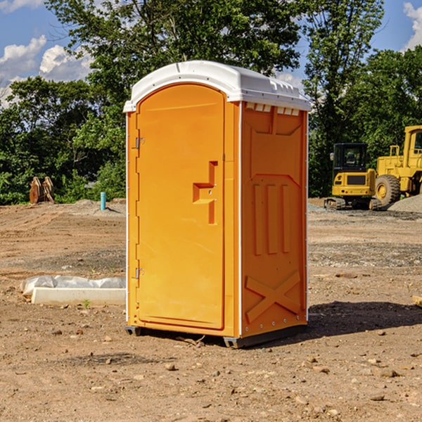 what is the cost difference between standard and deluxe porta potty rentals in Russell